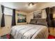 Cozy bedroom featuring neutral tones, natural lighting, and decorative artwork at 1437 Shannon Ave, Indianapolis, IN 46201