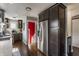 Spacious kitchen featuring stainless steel refrigerator, and custom dark brown cabinets at 1437 Shannon Ave, Indianapolis, IN 46201