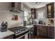 Well-appointed kitchen featuring stainless steel appliances, custom cabinets, and natural light at 1437 Shannon Ave, Indianapolis, IN 46201