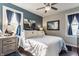 Cozy main bedroom featuring a comfortable bed, natural lighting, and stylish decor at 1437 Shannon Ave, Indianapolis, IN 46201