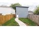 Backyard featuring a concrete walkway leading to a shed door, perfect for outdoor activities at 1452 Fletcher Ave, Indianapolis, IN 46203