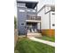 Inviting modern home exterior with a balcony, a small fenced yard, and modern design at 1452 Fletcher Ave, Indianapolis, IN 46203