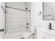 Stylish bathroom featuring white subway tile, black fixtures, and modern vanity at 1452 Fletcher Ave, Indianapolis, IN 46203