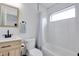Modern bathroom with stylish fixtures, a tiled shower, and natural light at 1452 Fletcher Ave, Indianapolis, IN 46203