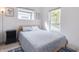 Cozy bedroom with a comfortable bed, natural light, and stylish decor at 1452 Fletcher Ave, Indianapolis, IN 46203