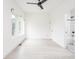 Bright bedroom featuring hardwood floors, white walls, and an attached bathroom at 1452 Fletcher Ave, Indianapolis, IN 46203