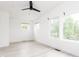 Open bedroom space with lots of natural light and a black ceiling fan at 1452 Fletcher Ave, Indianapolis, IN 46203
