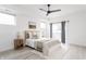 Bright bedroom with a ceiling fan, neutral decor, and sliding glass doors to the outside at 1452 Fletcher Ave, Indianapolis, IN 46203