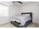Cozy bedroom includes a comfortable bed, neutral tones, and a large window at 1452 Fletcher Ave, Indianapolis, IN 46203