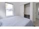 Bedroom features include a closet and natural light from a large window at 1452 Fletcher Ave, Indianapolis, IN 46203