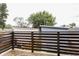 Spacious wooden deck overlooking the backyard with a view of neighboring homes at 1452 Fletcher Ave, Indianapolis, IN 46203