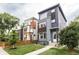 Modern homes with stylish exteriors, manicured lawns, and complementing architectural designs at 1452 Fletcher Ave, Indianapolis, IN 46203