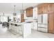 Bright, open kitchen with quartz counters, stainless steel appliances, and a large island with seating at 1452 Fletcher Ave, Indianapolis, IN 46203