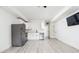 Open-concept kitchen with stainless steel appliances and sleek white cabinetry at 1452 Fletcher Ave, Indianapolis, IN 46203