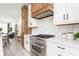 Elegant kitchen showcasing a stainless steel gas range and oven with white cabinets at 1452 Fletcher Ave, Indianapolis, IN 46203
