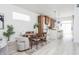Modern open layout featuring a dining area, and a stylish kitchen with white waterfall countertops at 1452 Fletcher Ave, Indianapolis, IN 46203