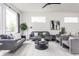 Spacious living room with a neutral color palette, modern decor, and large windows for natural light at 1452 Fletcher Ave, Indianapolis, IN 46203