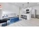 Open-concept living space with a modern kitchen, comfortable seating, and stylish decor at 1452 Fletcher Ave, Indianapolis, IN 46203