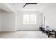 Bright living room features hardwood floors, ceiling fan, and plenty of natural light at 1452 Fletcher Ave, Indianapolis, IN 46203