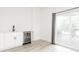 Bright living room featuring wet bar, wine fridge, and sliding glass door access to patio at 1452 Fletcher Ave, Indianapolis, IN 46203