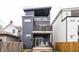 Modern home featuring a multi-level deck, stylish wood siding, and a contemporary architectural design at 1452 Fletcher Ave, Indianapolis, IN 46203