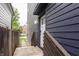 Stylish side entrance with a wooden walkway, providing a charming access point to the house at 1452 Fletcher Ave, Indianapolis, IN 46203