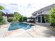 A backyard featuring an in-ground pool, hot tub, screened-in porch, and pergola offers luxury outdoor living at 1477 Macintosh Ct, Avon, IN 46123