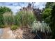 The outdoor area is adorned with lush landscaping, stone pavers, a fire pit, and metal accents at 1477 Macintosh Ct, Avon, IN 46123
