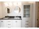 Bathroom featuring dual sinks, granite countertops, modern cabinets, and stylish lighting fixtures at 1477 Macintosh Ct, Avon, IN 46123