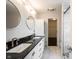 Elegant bathroom with double vanity, granite countertop, and marble tiled walls and flooring at 1477 Macintosh Ct, Avon, IN 46123