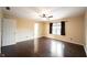 Bedroom featuring hardwood floors, a ceiling fan, a window offering natural light, and a doorway at 1477 Macintosh Ct, Avon, IN 46123