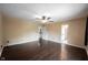 Spacious room with hardwood floors, ceiling fan, and neutral paint, creating a bright, airy space at 1477 Macintosh Ct, Avon, IN 46123