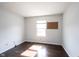 Bright bedroom with neutral walls, wood floors, and a large window allowing for plenty of natural light at 1477 Macintosh Ct, Avon, IN 46123