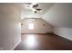 Spacious bonus room with hardwood floors, ceiling fan, and natural light streaming through the window at 1477 Macintosh Ct, Avon, IN 46123