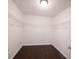 Empty walk-in closet featuring hardwood floors and wire shelving at 1477 Macintosh Ct, Avon, IN 46123