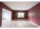 Dining room features wood floors, textured ceiling and an adjacent living area at 1477 Macintosh Ct, Avon, IN 46123