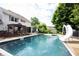 Backyard pool with slide and patio offers a serene and refreshing outdoor oasis for relaxation and recreation at 1477 Macintosh Ct, Avon, IN 46123