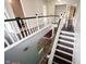 View of the staircase with white railings, wooden steps and hardwood flooring on the second floor of the home at 1477 Macintosh Ct, Avon, IN 46123