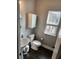 Powder room with pedestal sink, toilet, medicine cabinet and window at 15873 Hush Hickory Bnd, Westfield, IN 46074