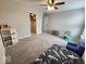 Carpeted bedroom with ceiling fan, closet, and window at 15873 Hush Hickory Bnd, Westfield, IN 46074
