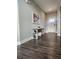 Hallway with dark wood floors, neutral walls, and decorative console table at 15873 Hush Hickory Bnd, Westfield, IN 46074