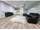 Inviting living room with plush seating, a large rug, and a media center for entertainment at 15873 Hush Hickory Bnd, Westfield, IN 46074