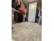 Walk-in closet with ample hanging space, white storage cabinet, and carpeted floor at 15873 Hush Hickory Bnd, Westfield, IN 46074