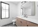 Bathroom featuring a vanity with quartz countertops, dark fixtures, and a nearby toilet at 1677 Solebar Way, Westfield, IN 46074