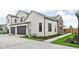 Modern two-story home showcasing a two-car garage, neutral siding, and manicured landscaping at 1677 Solebar Way, Westfield, IN 46074