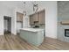 Spacious kitchen featuring a large center island, custom cabinets, and contemporary lighting fixtures at 1677 Solebar Way, Westfield, IN 46074