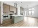 Contemporary kitchen featuring a center island, stainless steel appliances, and stylish lighting at 1677 Solebar Way, Westfield, IN 46074