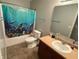 Bathroom featuring a shower with ocean themed curtain, single sink vanity at 1711 Jaques Dr, Lebanon, IN 46052