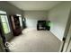 Carpeted bedroom featuring two large windows, a dark wood bookcase, a computer desk and chair at 1711 Jaques Dr, Lebanon, IN 46052