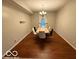 Dining room with a marble table, chandelier and hardwood floors for an elegant entertaining space at 1711 Jaques Dr, Lebanon, IN 46052